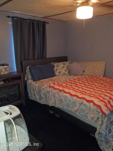 a view of storage and utility room with wooden floor