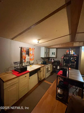 a kitchen with lots of appliances and cabinets