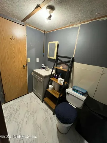 a bedroom with a bed and a shower