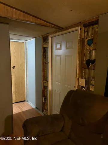 a bedroom with a bed and a lamp