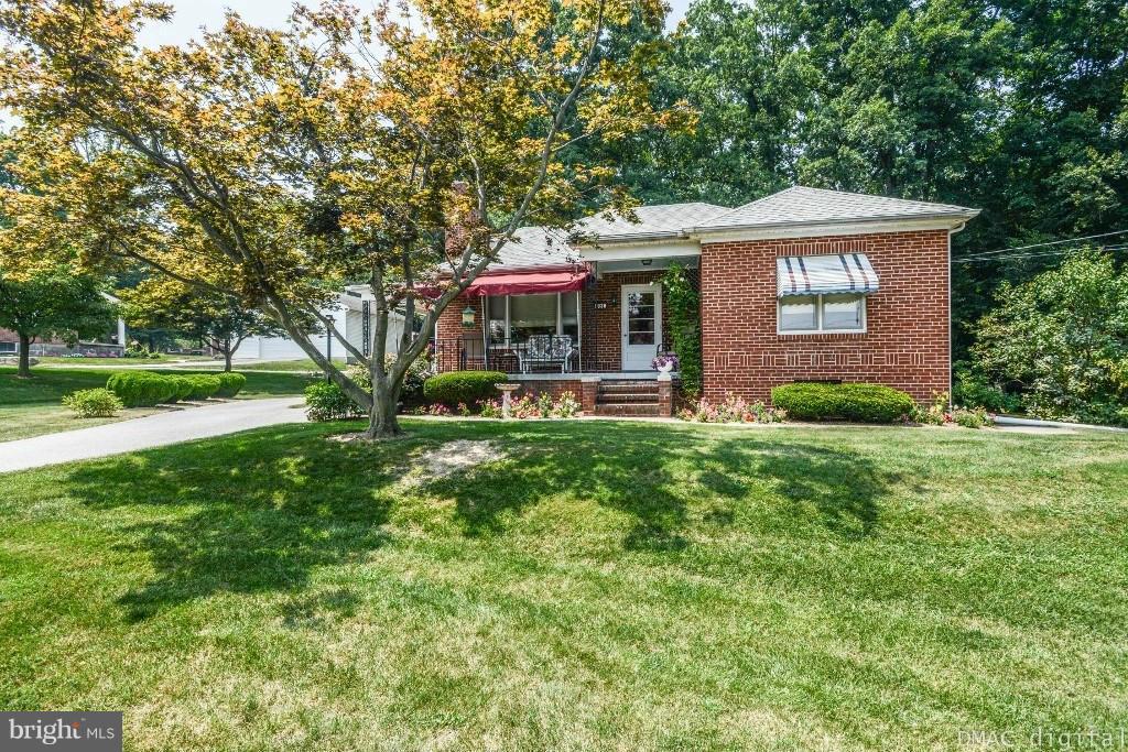 9030 Bethel Road Frederick, MD 21702 - Photo 1 of 28 a front view of a house with garden