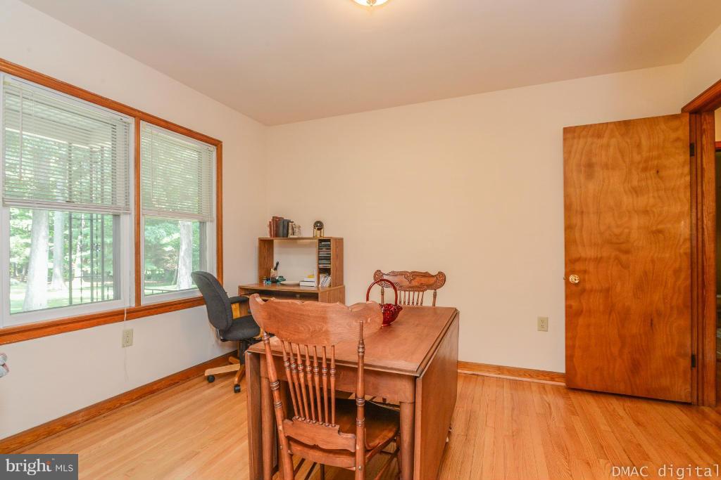 9030 Bethel Road Frederick, MD 21702 - Photo 12 of 28 a dining room with furniture and a floor to ceiling window