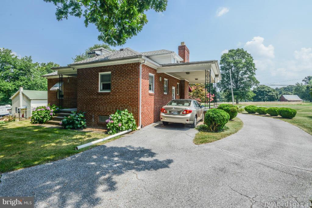 9030 Bethel Road Frederick, MD 21702 - Photo 22 of 28 a view of a house with a yard and a garage