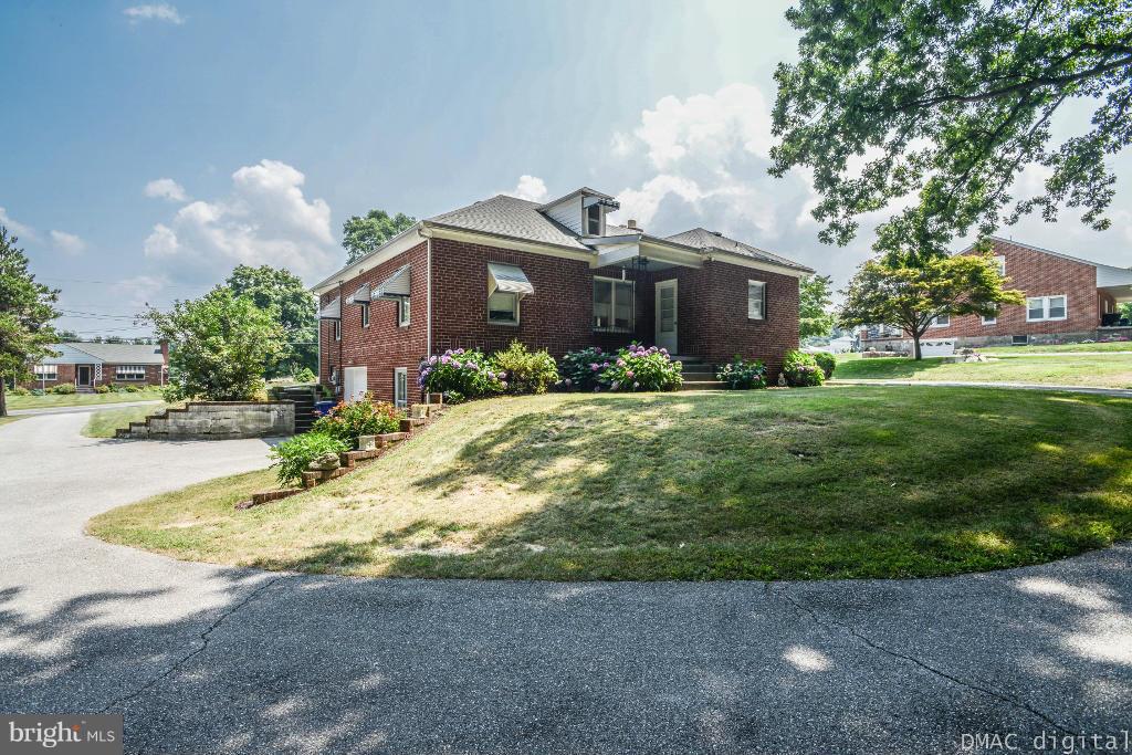 9030 Bethel Road Frederick, MD 21702 - Photo 24 of 28 a front view of a house with a yard