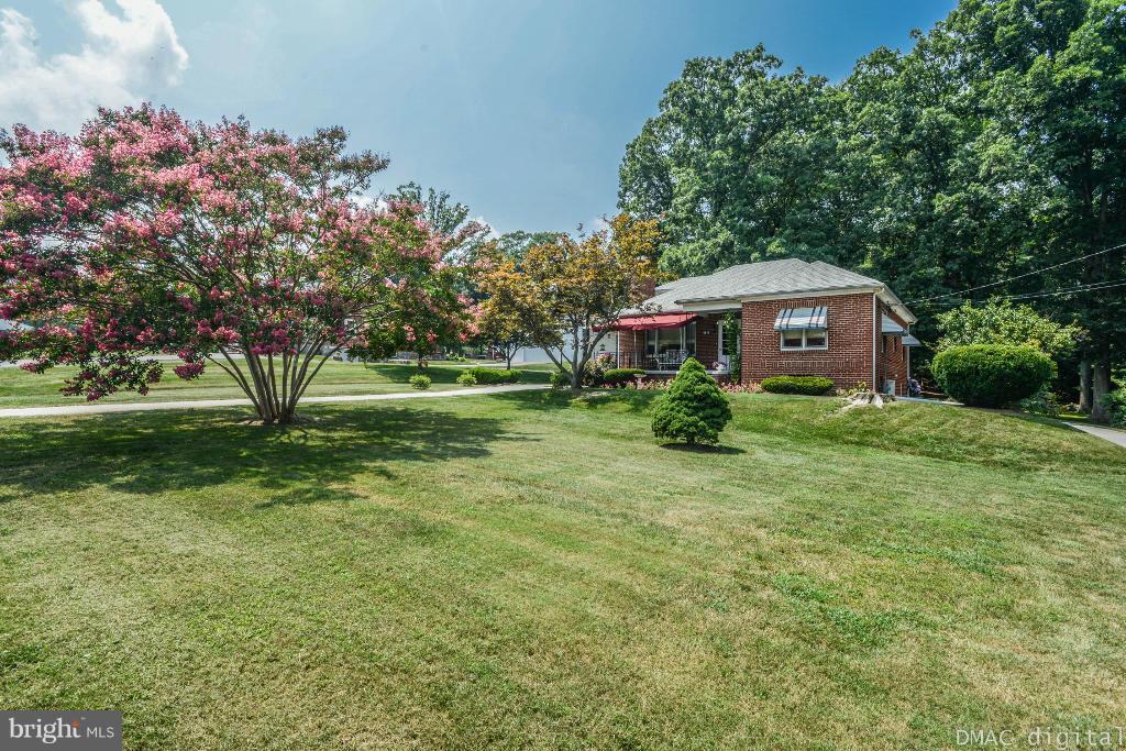 9030 Bethel Road Frederick, MD 21702 - Photo 26 of 28 a front view of a house with garden