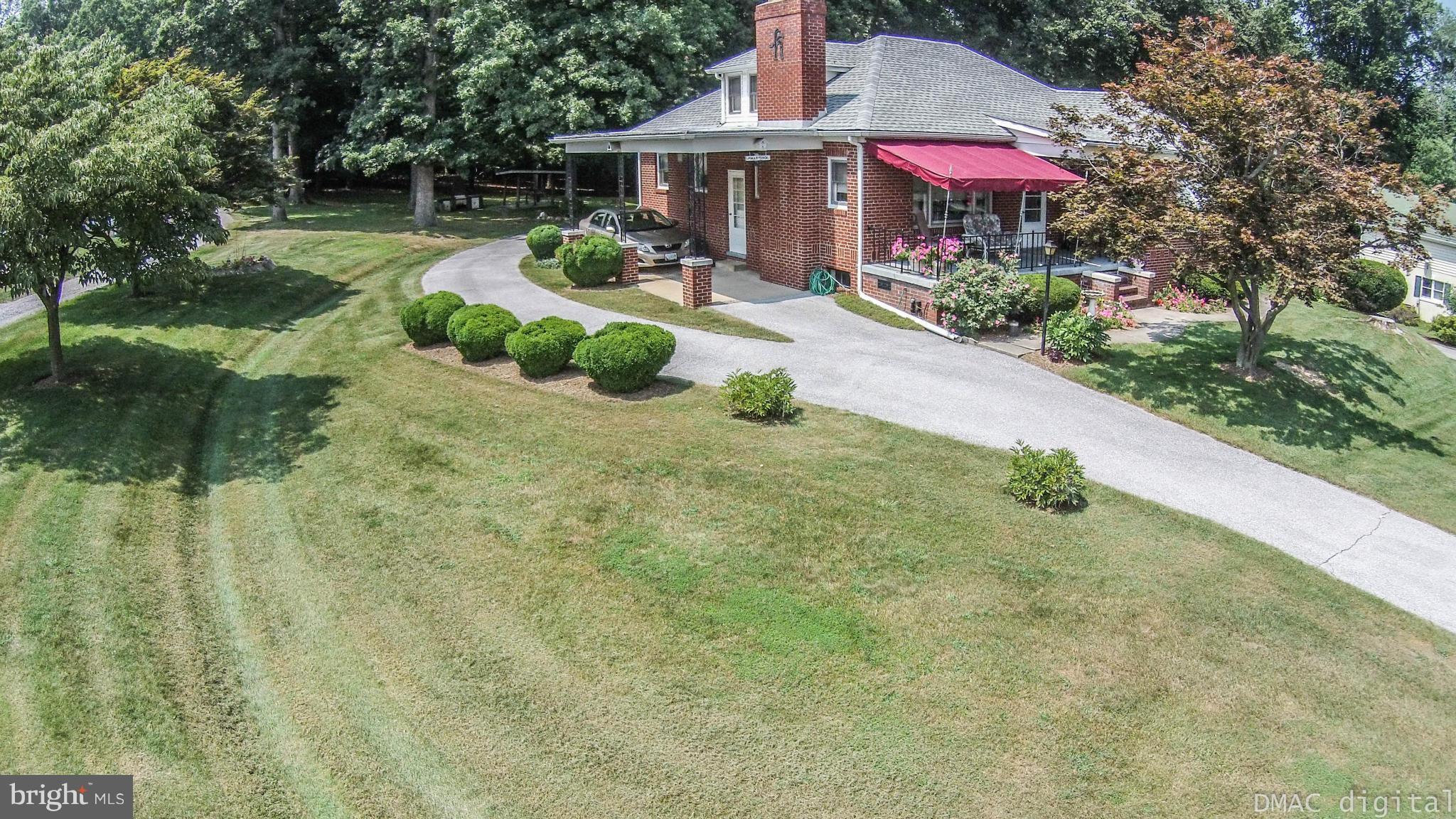 9030 Bethel Road Frederick, MD 21702 - Photo 27 of 28 a front view of a house with yard and green space