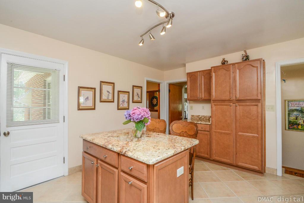9030 Bethel Road Frederick, MD 21702 - Photo 7 of 28 a kitchen with a refrigerator and countertop