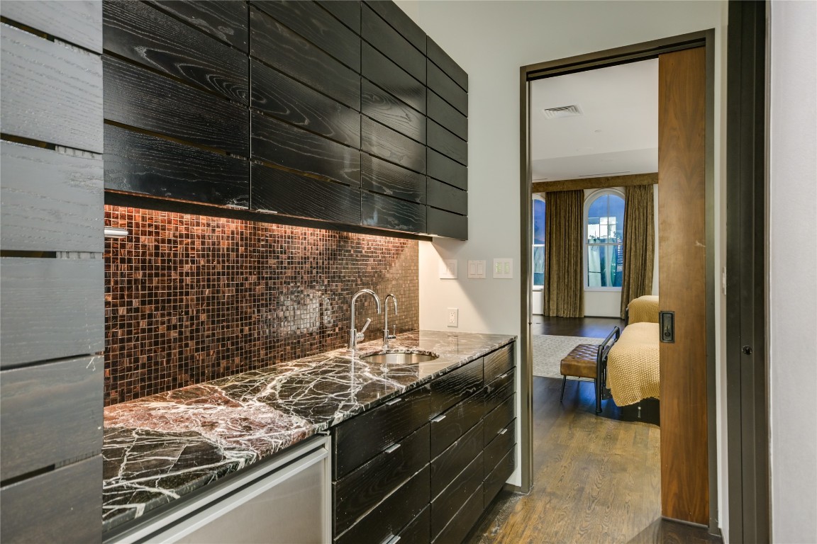 811 Congress Avenue Austin, TX 78701 - Photo 15 of 39 a kitchen with a stove and a cabinet