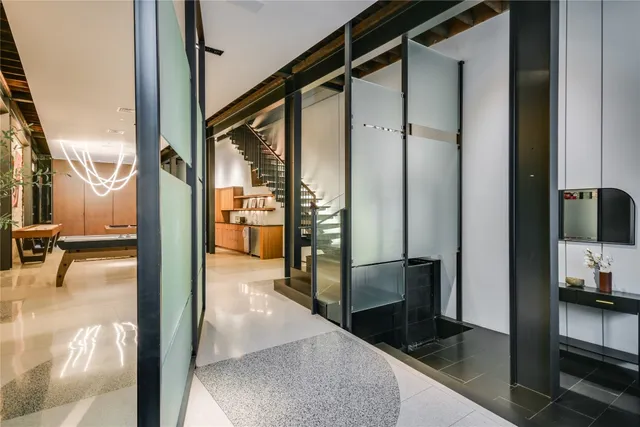 a view of a hallway with a living room