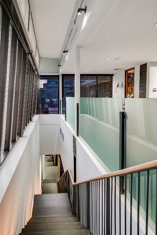 811 Congress Avenue Austin, TX 78701 - Photo 28 of 39 a view of a hallway with wooden floor and staircase