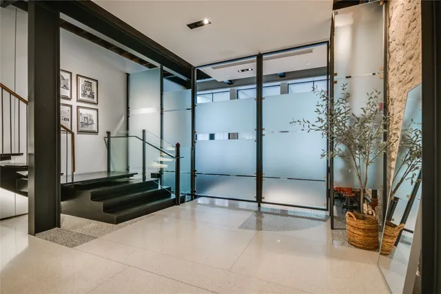 a bathroom with a shower and a mirror