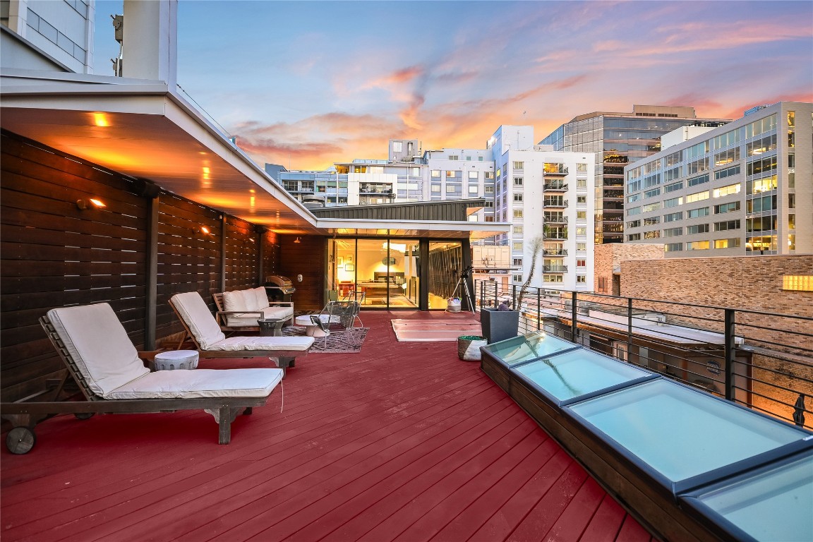 811 Congress Avenue Austin, TX 78701 - Photo 33 of 39 a outdoor space with patio the couches and a dining table with the ocean view