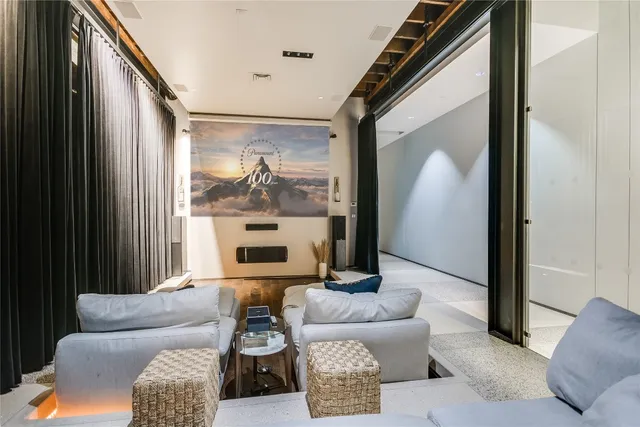 a room with lots of wooden cabinets and stainless steel appliances