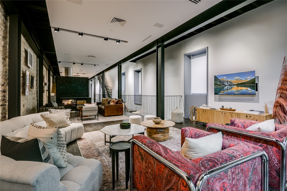 811 Congress Avenue Austin, TX 78701 - Photo 5 of 39 a living room with furniture and a flat screen tv