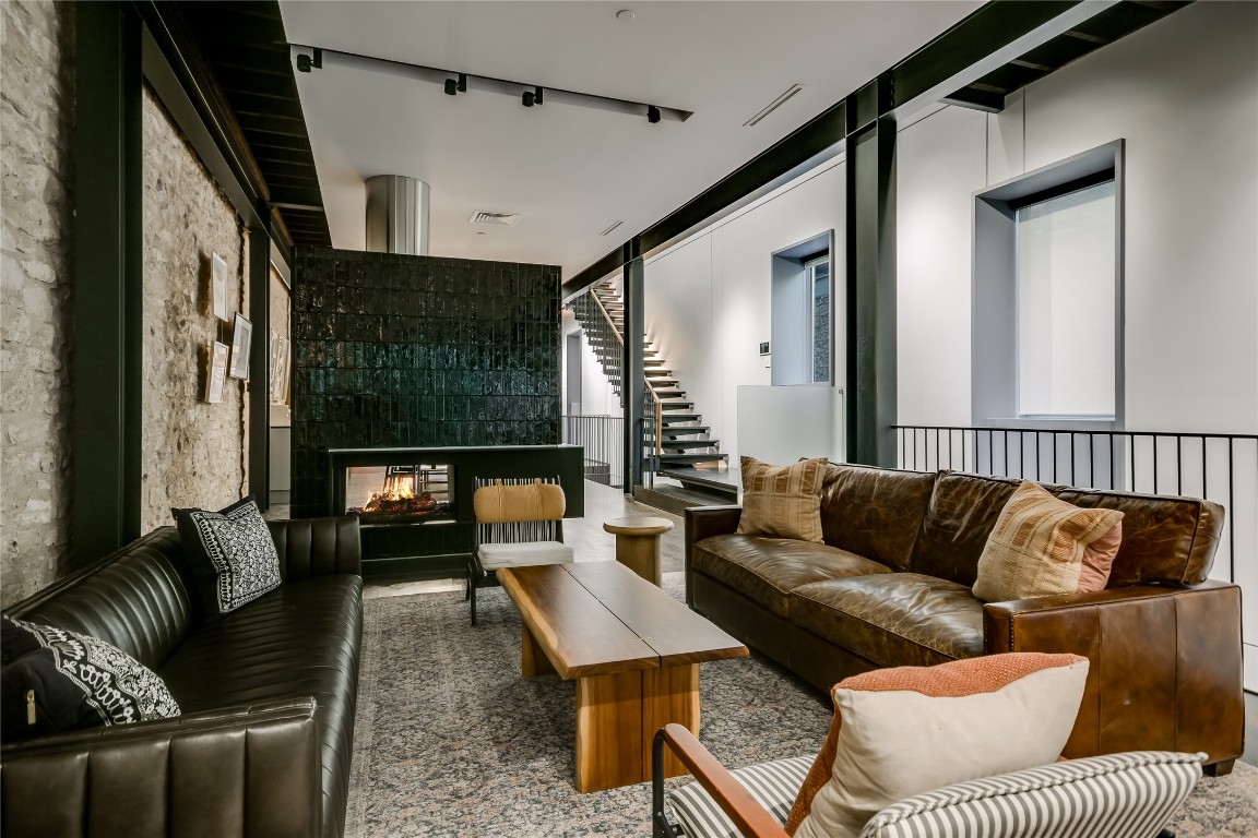 811 Congress Avenue Austin, TX 78701 - Photo 6 of 39 a living room with furniture and a flat screen tv