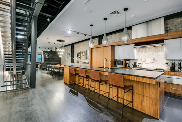 a large kitchen with lots of counter space and glass windows