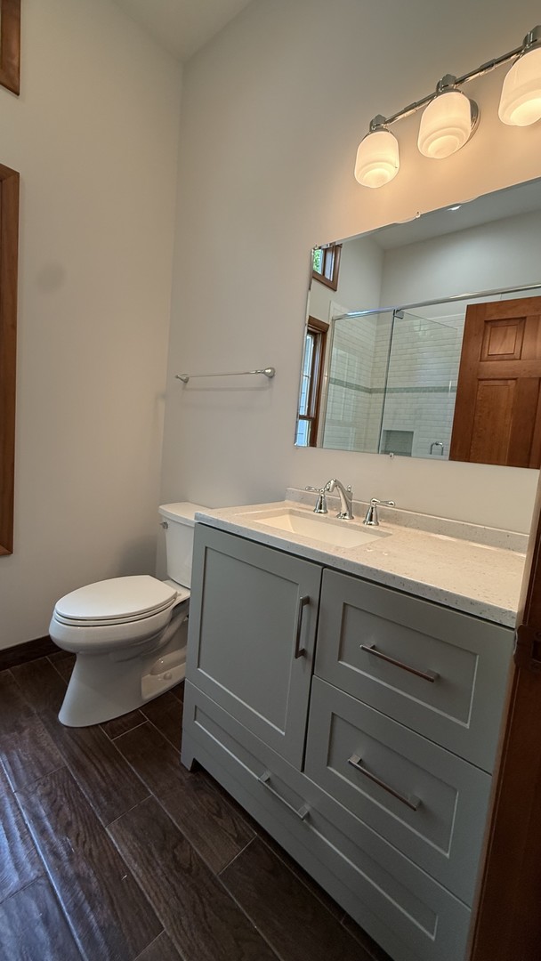 2841 Orange Brace Road Deerfield, IL 60015 - Photo 24 of 30 a bathroom with a sink and a toilet