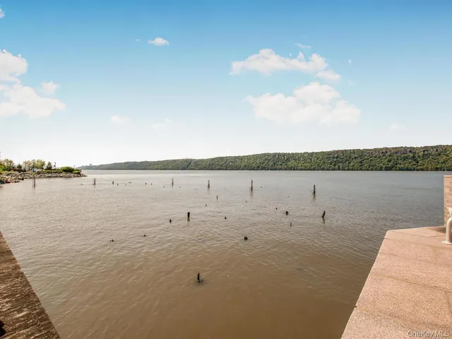 a view of a brick building next to a yard