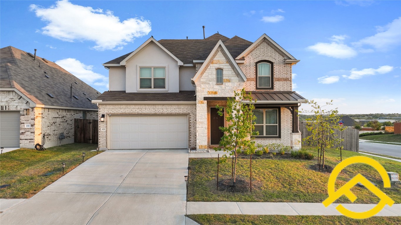 671 Durian Loop Buda, TX 78610 - Photo 1 of 29 a view of a white house with a swimming pool