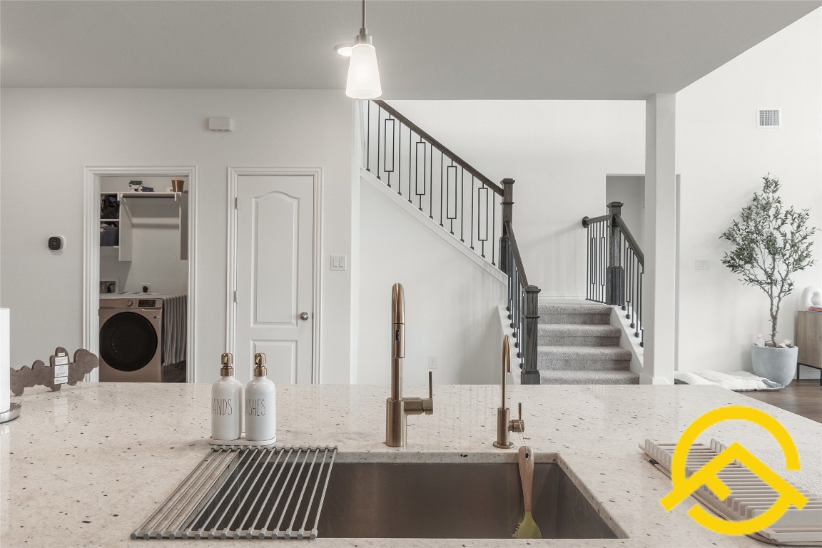 671 Durian Loop Buda, TX 78610 - Photo 11 of 29 a view of a livingroom with furniture and staircase