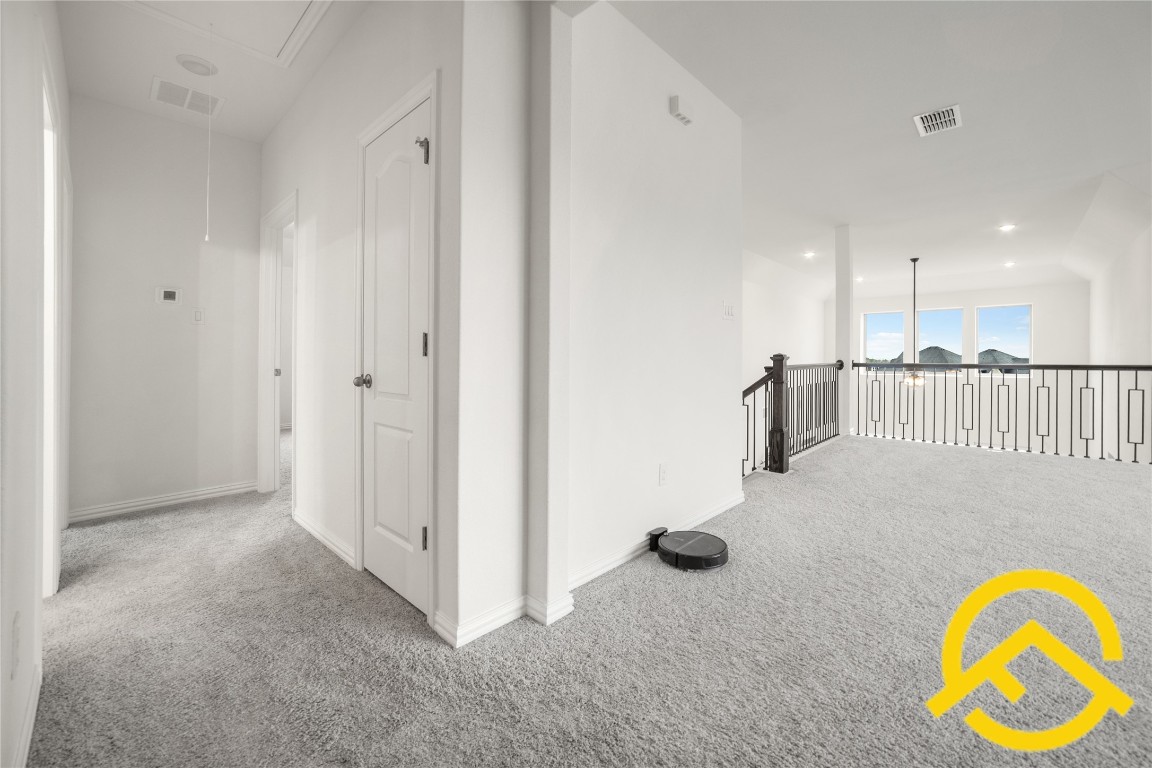 671 Durian Loop Buda, TX 78610 - Photo 13 of 29 a view of an entryway with wooden floor