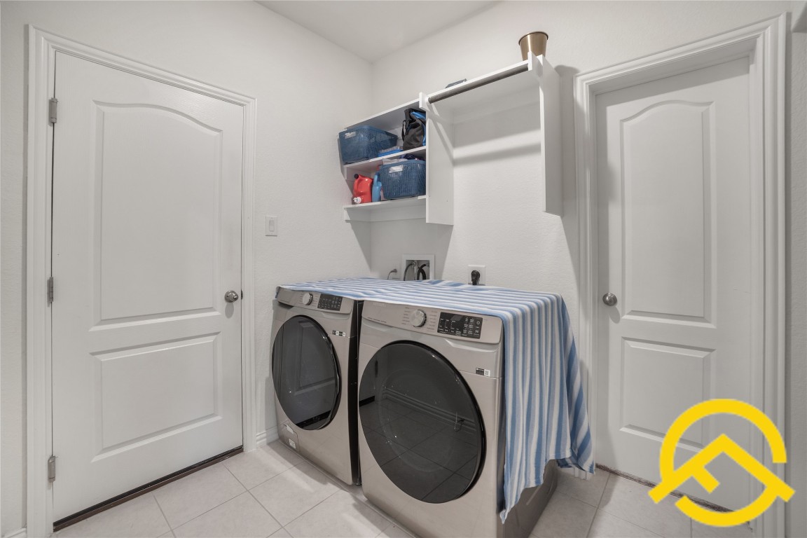 671 Durian Loop Buda, TX 78610 - Photo 25 of 29 a utility room with dryer and washer