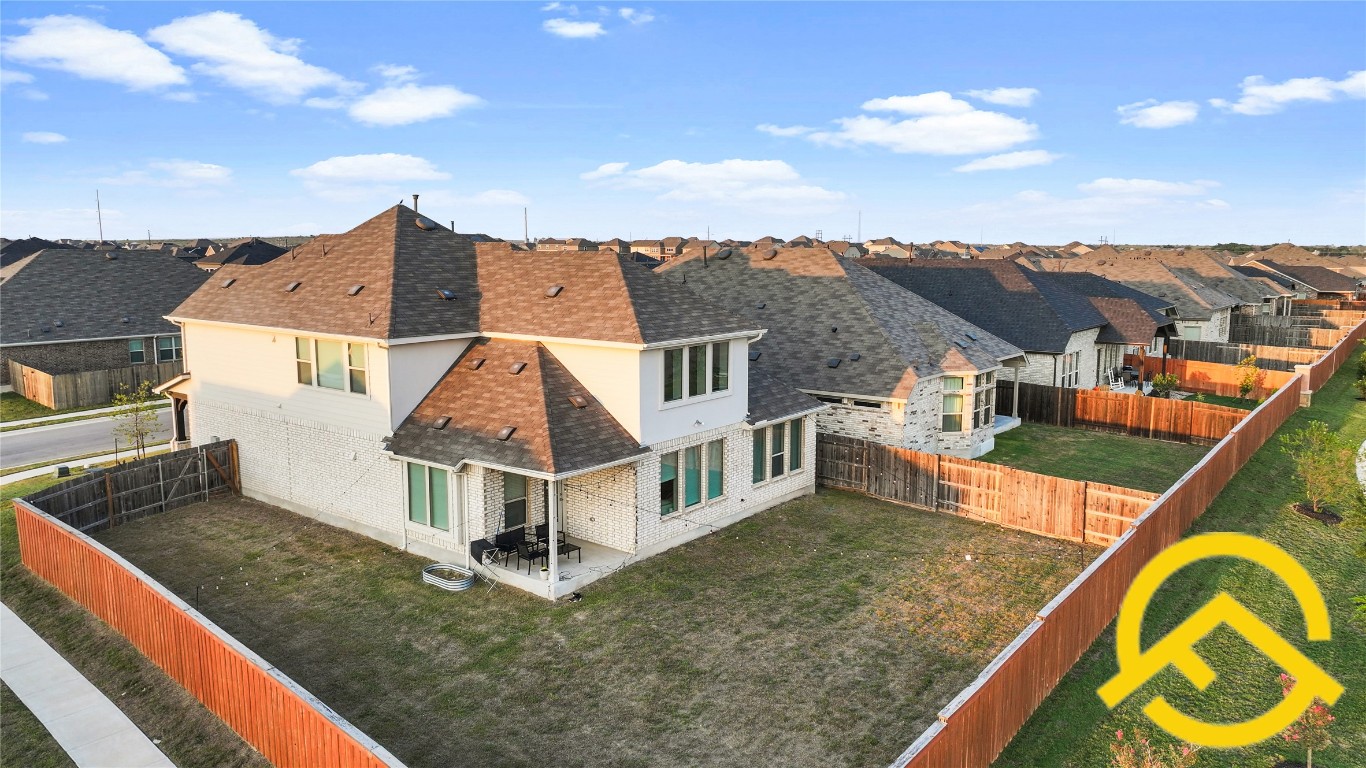 671 Durian Loop Buda, TX 78610 - Photo 26 of 29 an aerial view of house with a swimming pool