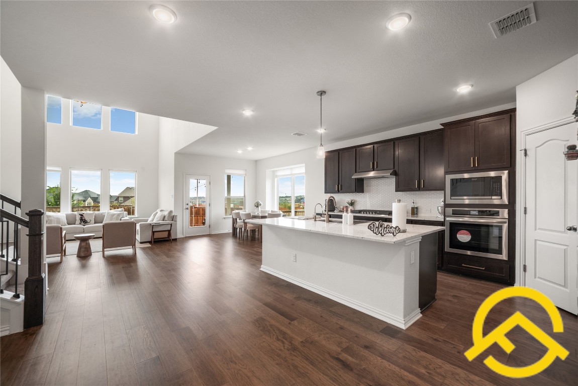 671 Durian Loop Buda, TX 78610 - Photo 29 of 29 a view of kitchen with stainless steel appliances granite countertop lots of counter top space