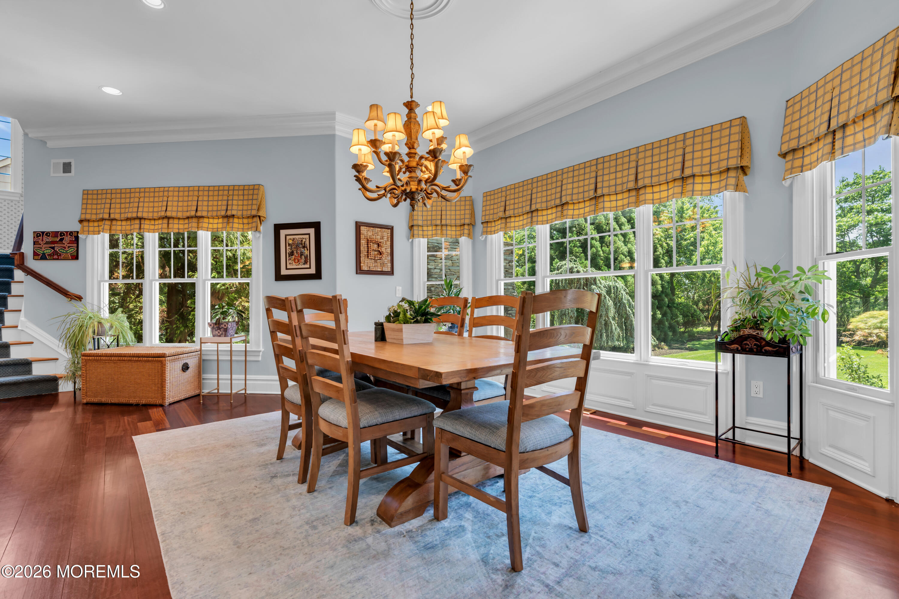 600 Little Silver Point Road Little Silver, NJ 07739 - Photo 20 of 55 a dining room with furniture a chandelier and wooden floor