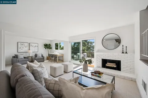 a living room with furniture fireplace and a fireplace
