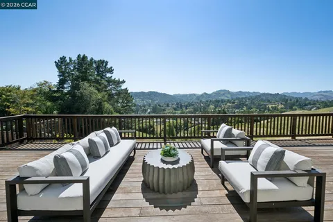 a view of a chairs and table on the deck
