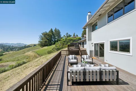 a view of balcony with furniture