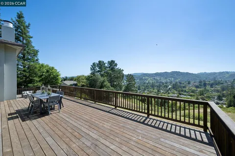 a view of balcony with deck and wooden floor