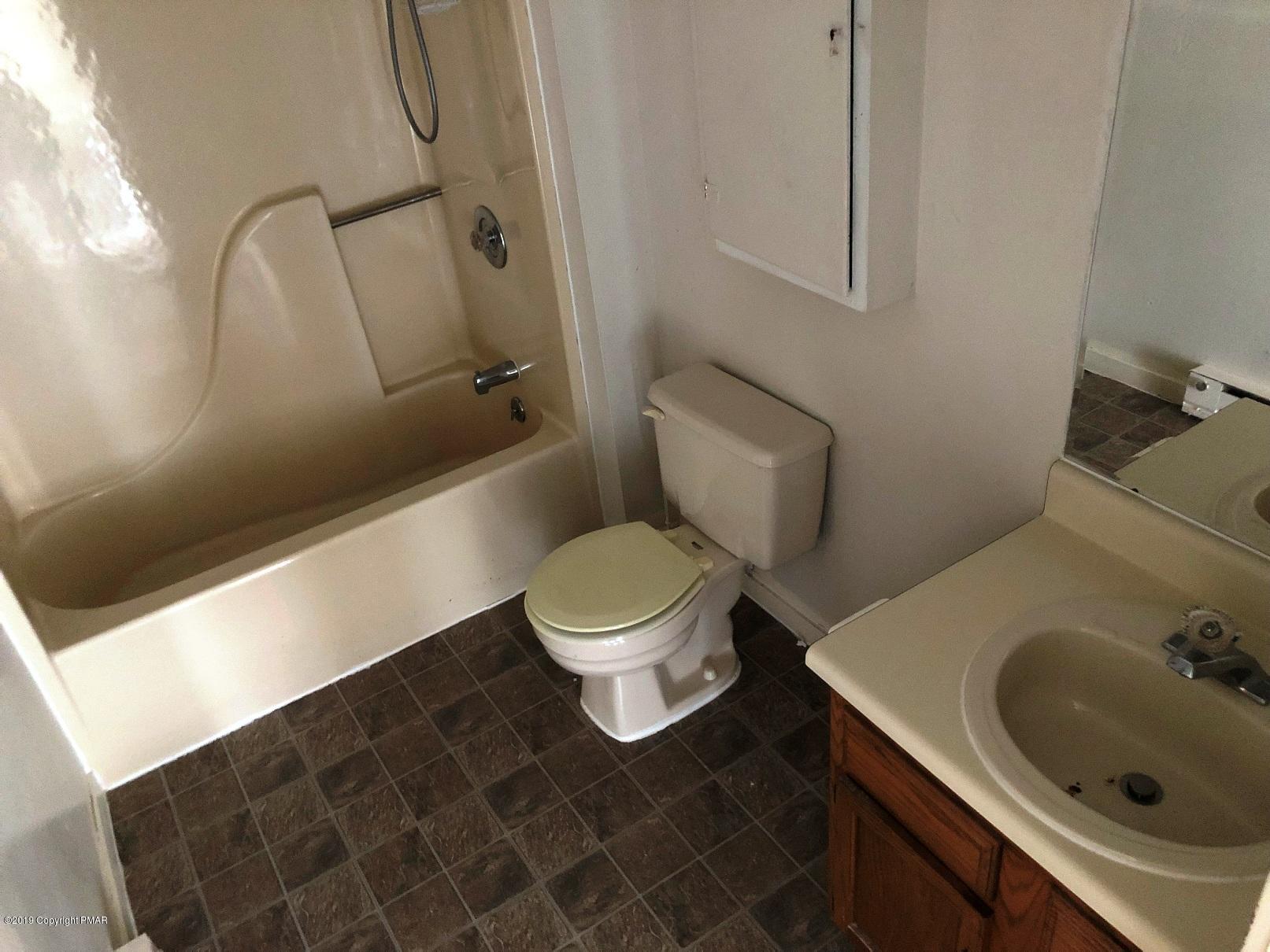 327 Crewe Court Bushkill, PA 18324 - Photo 9 of 10 a bathroom with a sink a toilet and shower