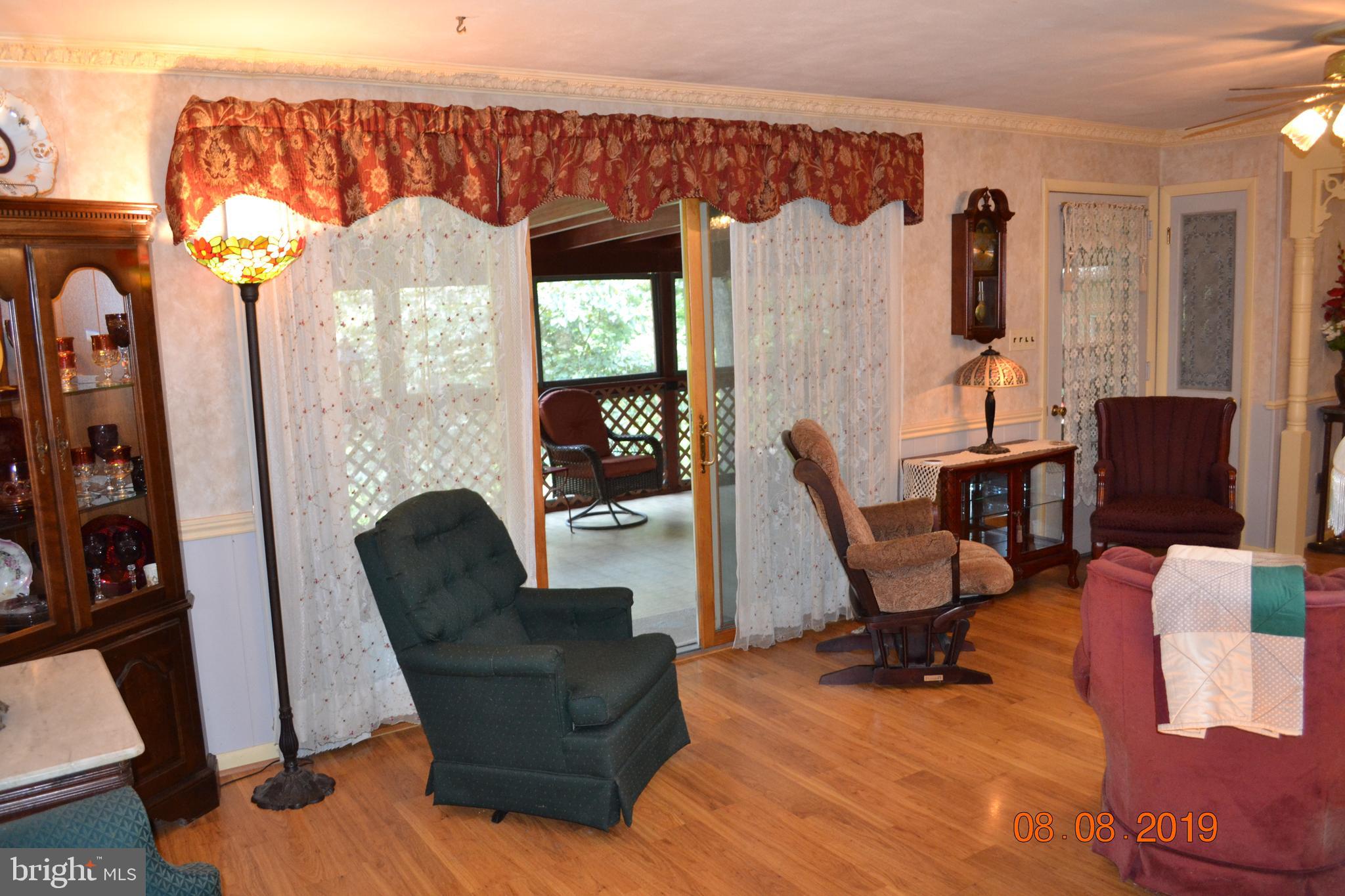 480 Ridge Road Gettysburg, PA 17325 - Photo 24 of 97 Living Room with door to screened in porch