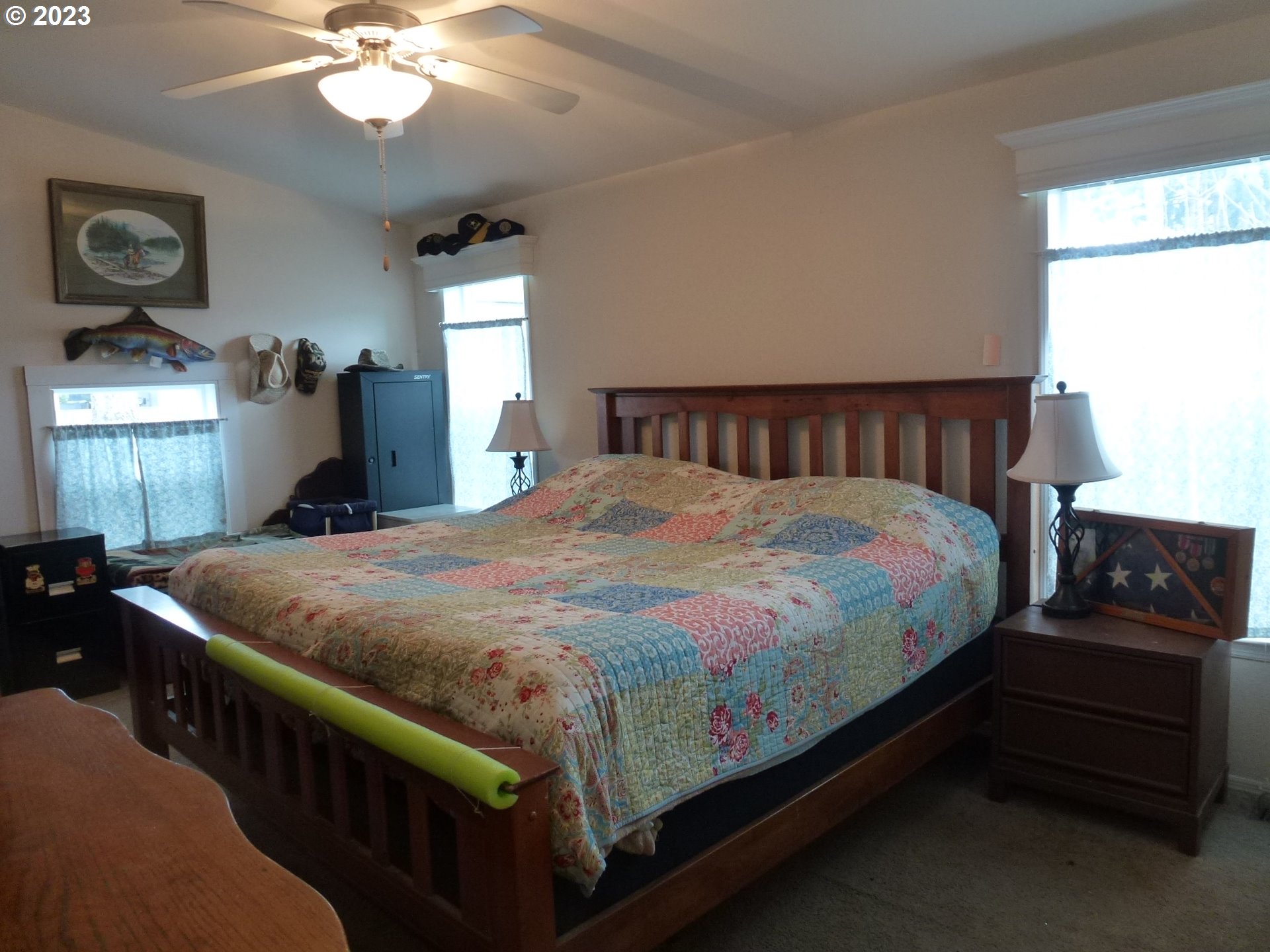 151 Edwards Road South, Unit 87 Monmouth, OR 97361 - Photo 13 of 18 a bed sitting in a bedroom next to a window