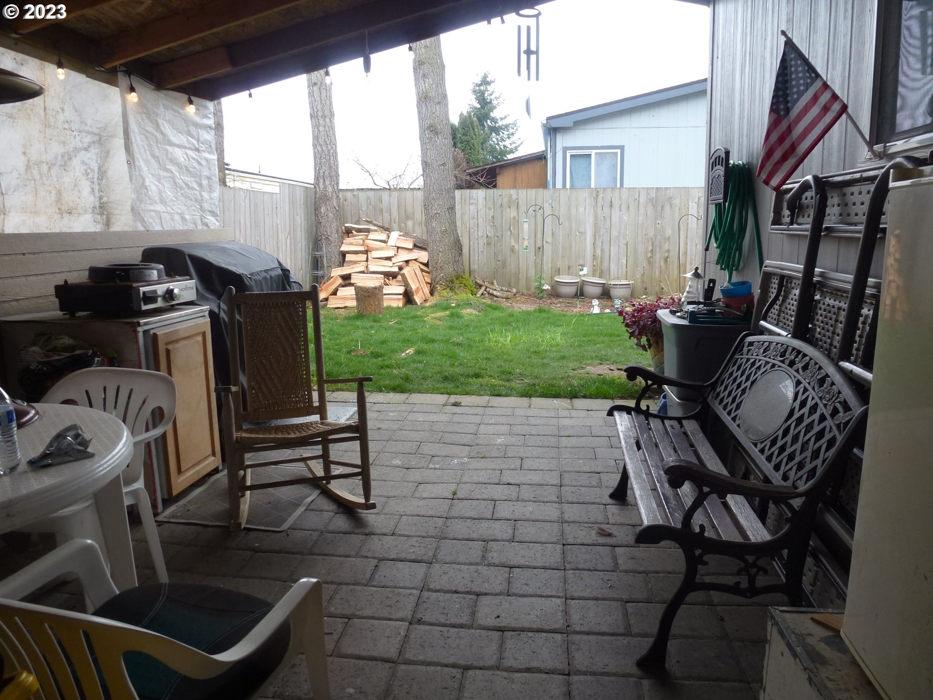 151 Edwards Road South, Unit 87 Monmouth, OR 97361 - Photo 15 of 18 a view of a chair and table in backyard of the house