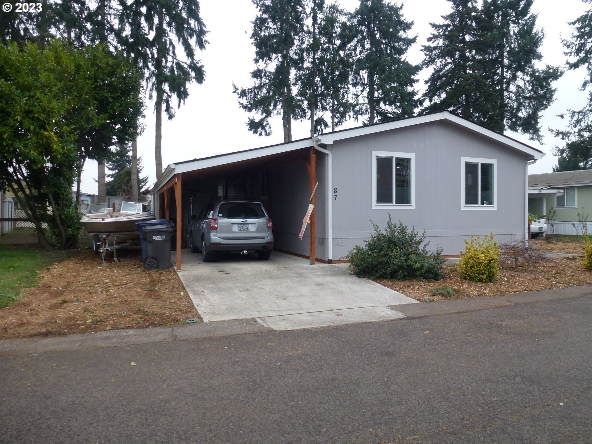 151 Edwards Road South, Unit 87 Monmouth, OR 97361 - Photo 2 of 18 a house view with a outdoor space