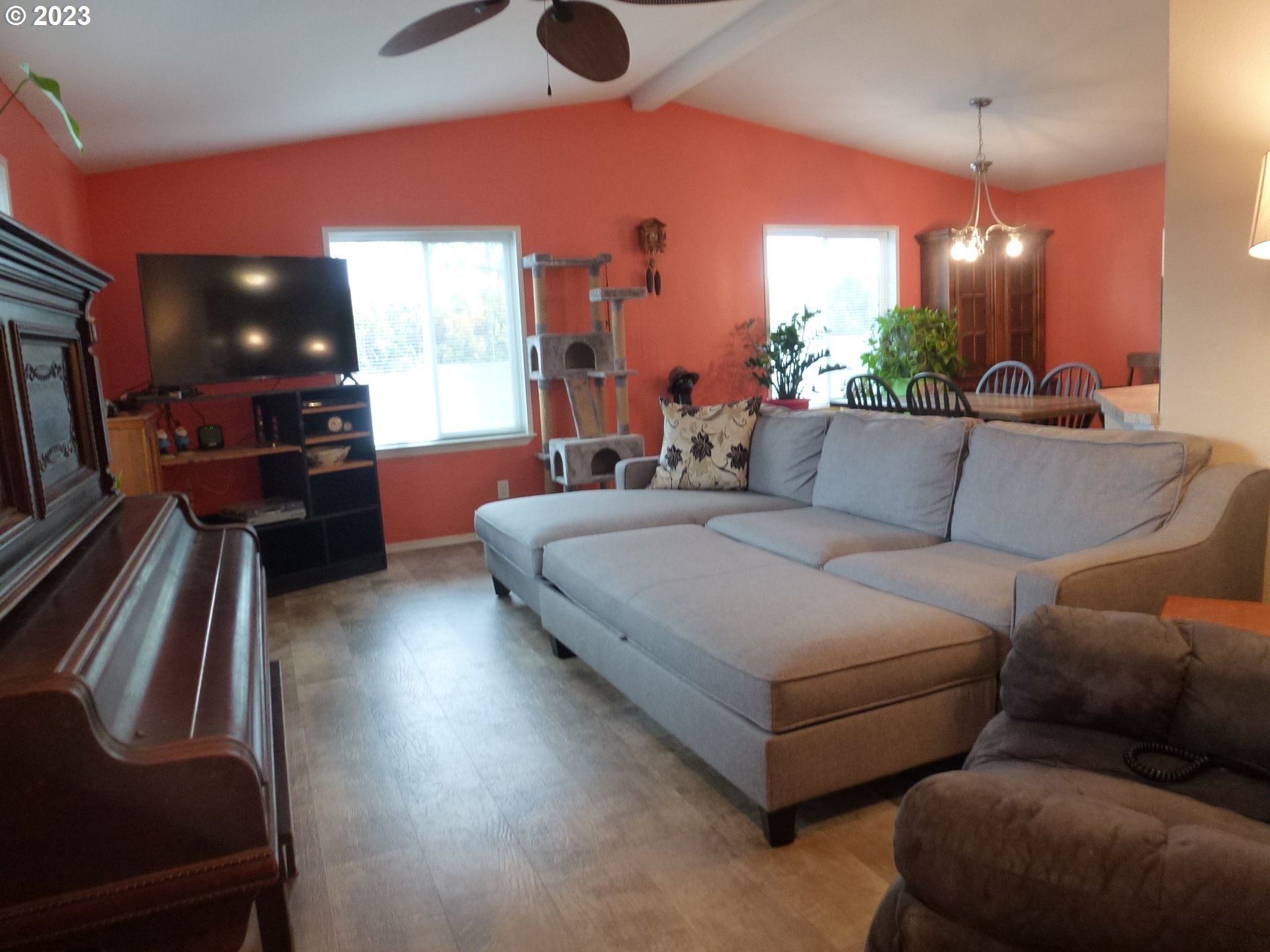 151 Edwards Road South, Unit 87 Monmouth, OR 97361 - Photo 3 of 18 a living room with furniture and a flat screen tv