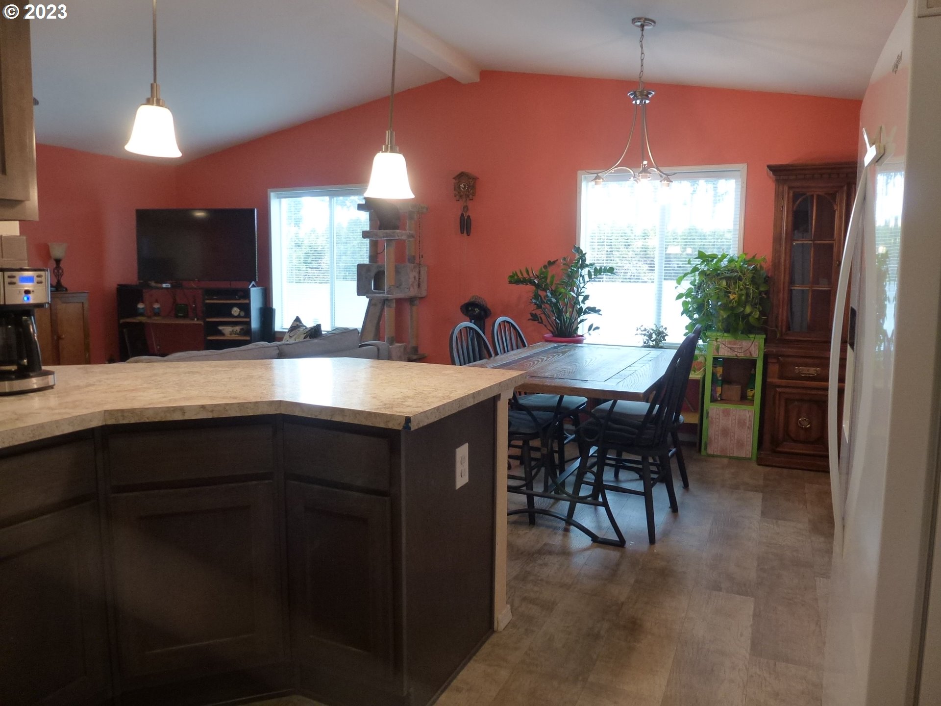 151 Edwards Road South, Unit 87 Monmouth, OR 97361 - Photo 5 of 18 a kitchen with kitchen island granite countertop a sink counter and chairs