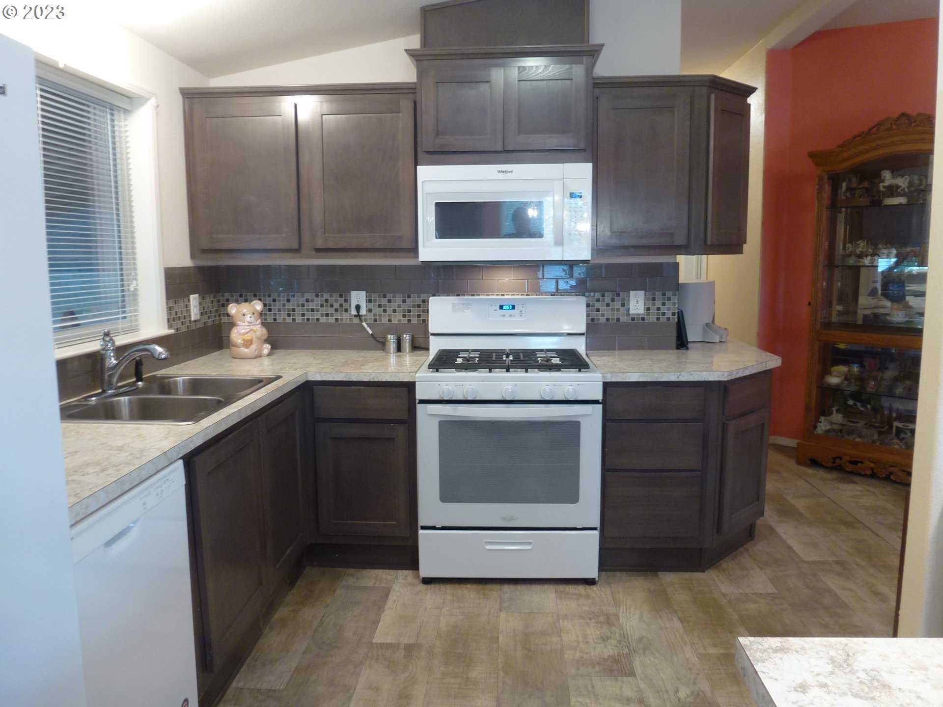 151 Edwards Road South, Unit 87 Monmouth, OR 97361 - Photo 8 of 18 a kitchen with a stove sink and cabinets