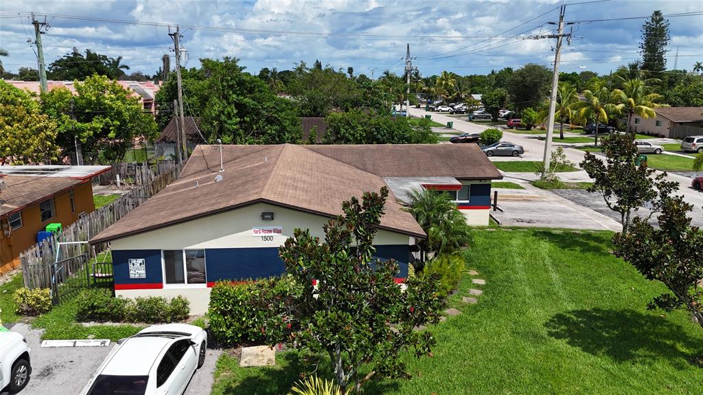 1500 Northwest 58th Terrace Sunrise, FL 33313 - Photo 3 of 3 a aerial view of a house with a yard table and chairs