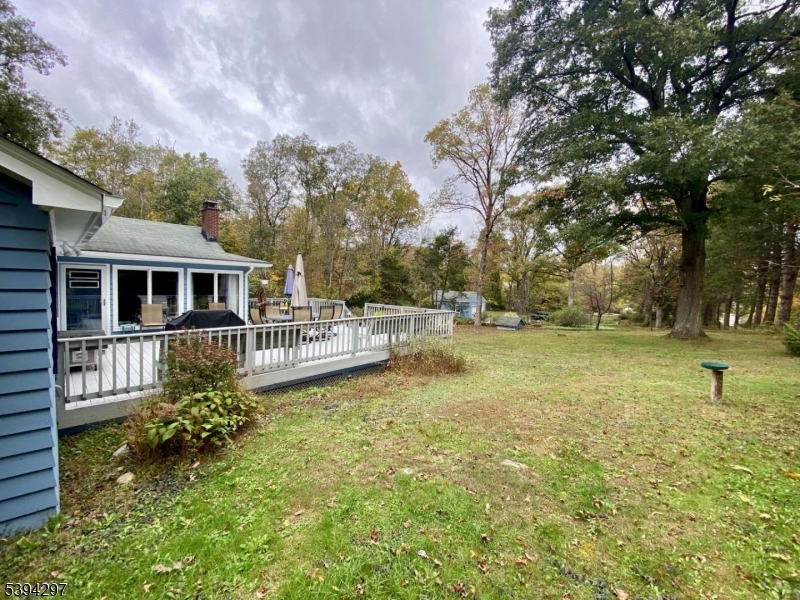 7 Stempert Road Branchville, NJ 07826 - Photo 16 of 50 a house view with swimming pool and trees in the background