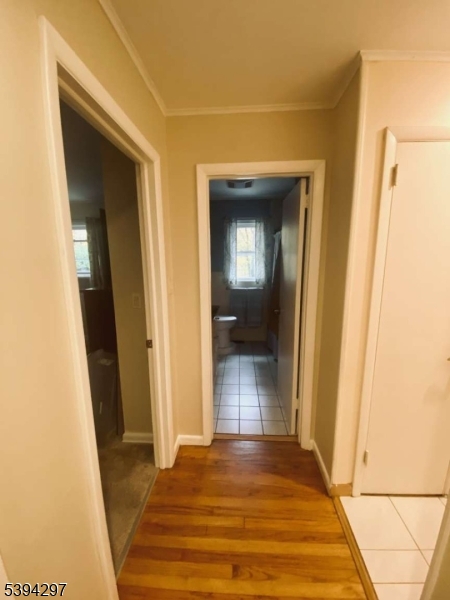 7 Stempert Road Branchville, NJ 07826 - Photo 19 of 50 a view of a hallway with wooden floor and a bathroom