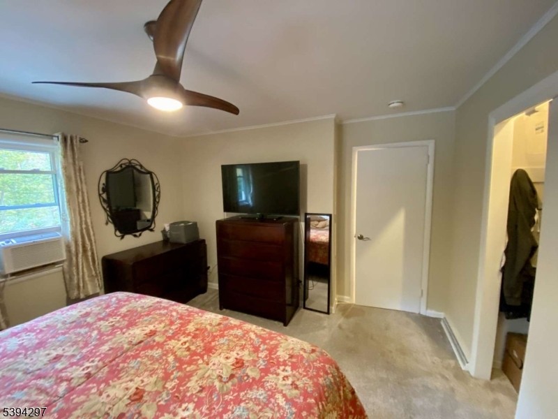7 Stempert Road Branchville, NJ 07826 - Photo 22 of 50 a bedroom with a bed and a flat screen tv