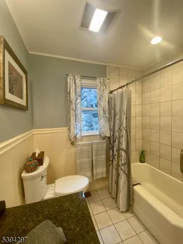 a view of a closet and a mirror