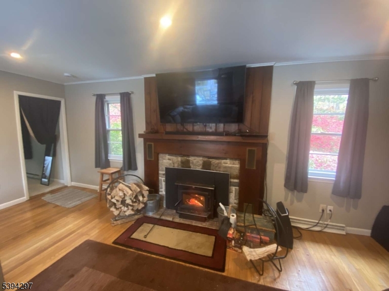 7 Stempert Road Branchville, NJ 07826 - Photo 32 of 50 a living room with furniture and a fireplace