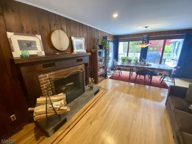 a spacious bedroom with a bed and wooden floor