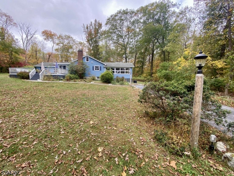 7 Stempert Road Branchville, NJ 07826 - Photo 10 of 50 a front view of a house with a yard and mountain view in back