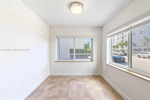 a view of an empty room with a window